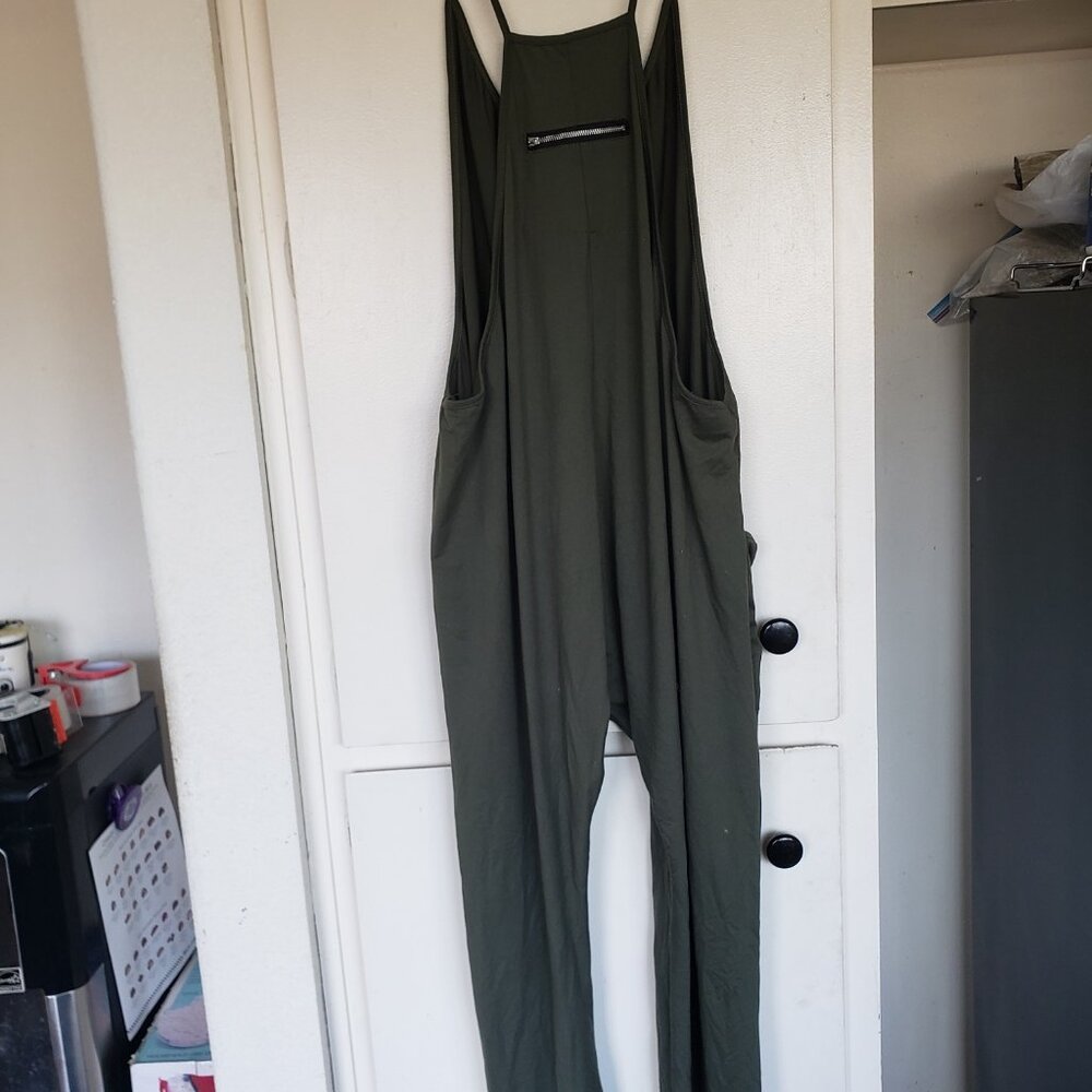 Green Overalls looks to be made from Cotton